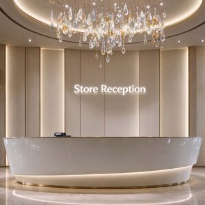 Store Reception curved white solid surface reception desk with gold trim and base LED light, in a bright hotel lobby with fabric feature wall and crystal chandelier